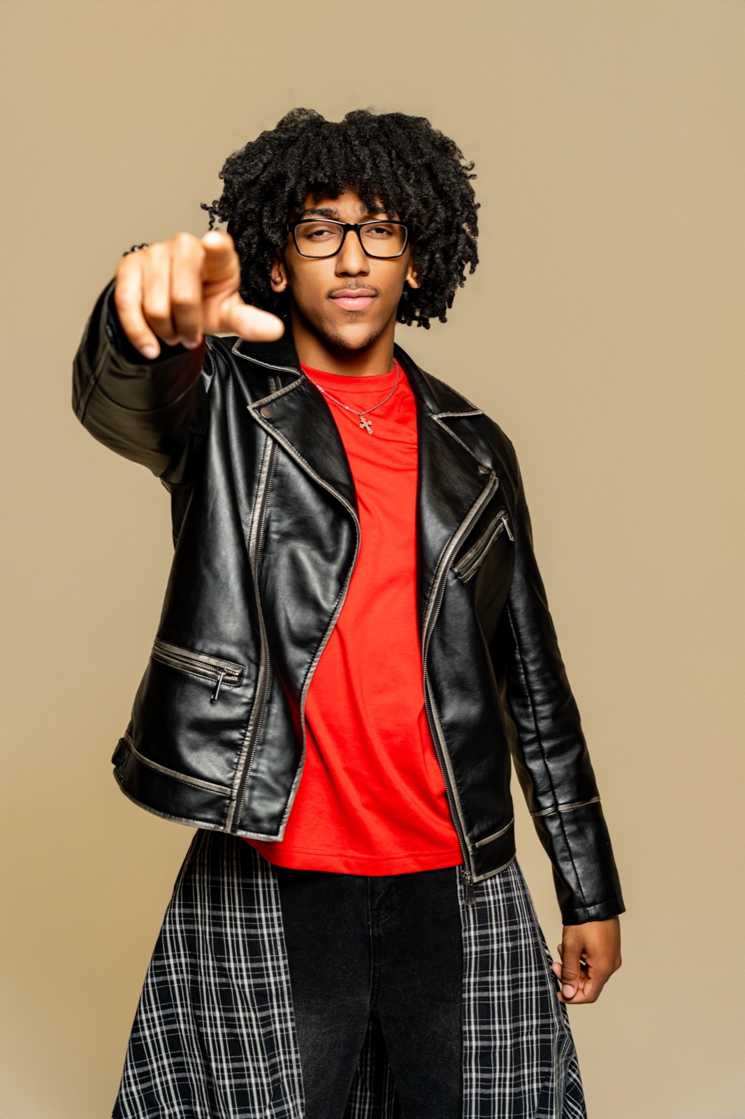Mark Ellis Jr. performing live in orange blazer